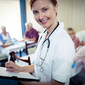 bigstock Portrait of a nurse with clipb 137591210 600x
